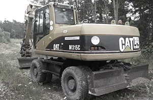Hjulgrävare Cat M315C med schaktblad